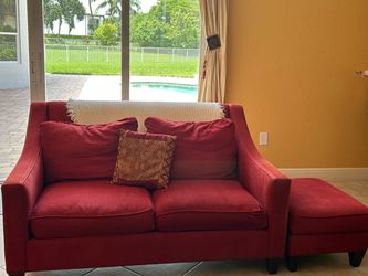 Red love seat sofa with ottoman