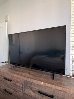 LG 49" 4K UHD Smart TV w/ Legs & TV Remote