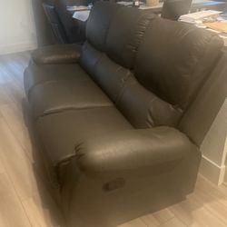 Gray Leather Reclining Sofa 