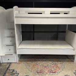 Rooms To Go.Bunk bed.Twin over Twin. In White, with step and 4 drawers. Mattresses included. Delivery available for an additional cost. 