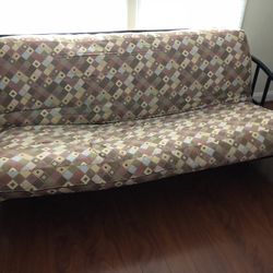 Futon With Black Metal Frame and Funky Patterned Futon Mattress