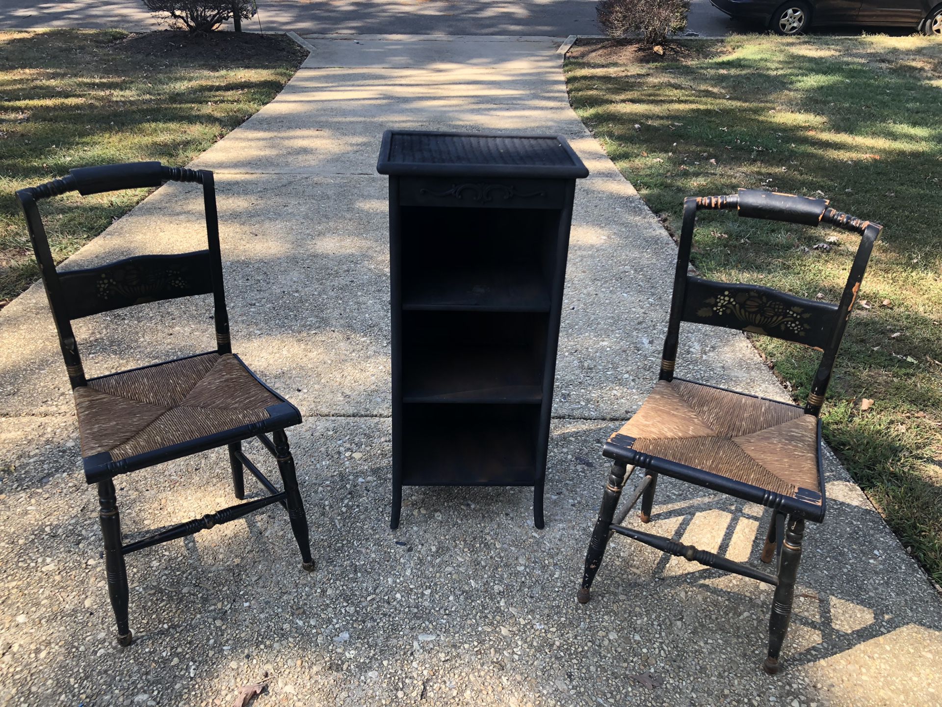Two wooden black Cain chairs- bookshelf is sold
