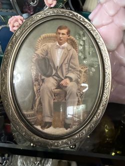 Antique oval picture frame ornate silver-colored scroll pattern 4.75”