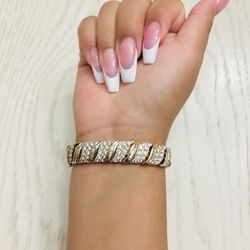 10 CT. T.W. Baguette and Round Diamond Wave Bracelet in 10K Gold 7 Inches length