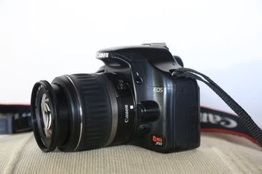 Canon Rebel XSi digital SLR camera with EF-S 18-55mm f/3.5-5.6 IS lens, charger,  battery, SD card