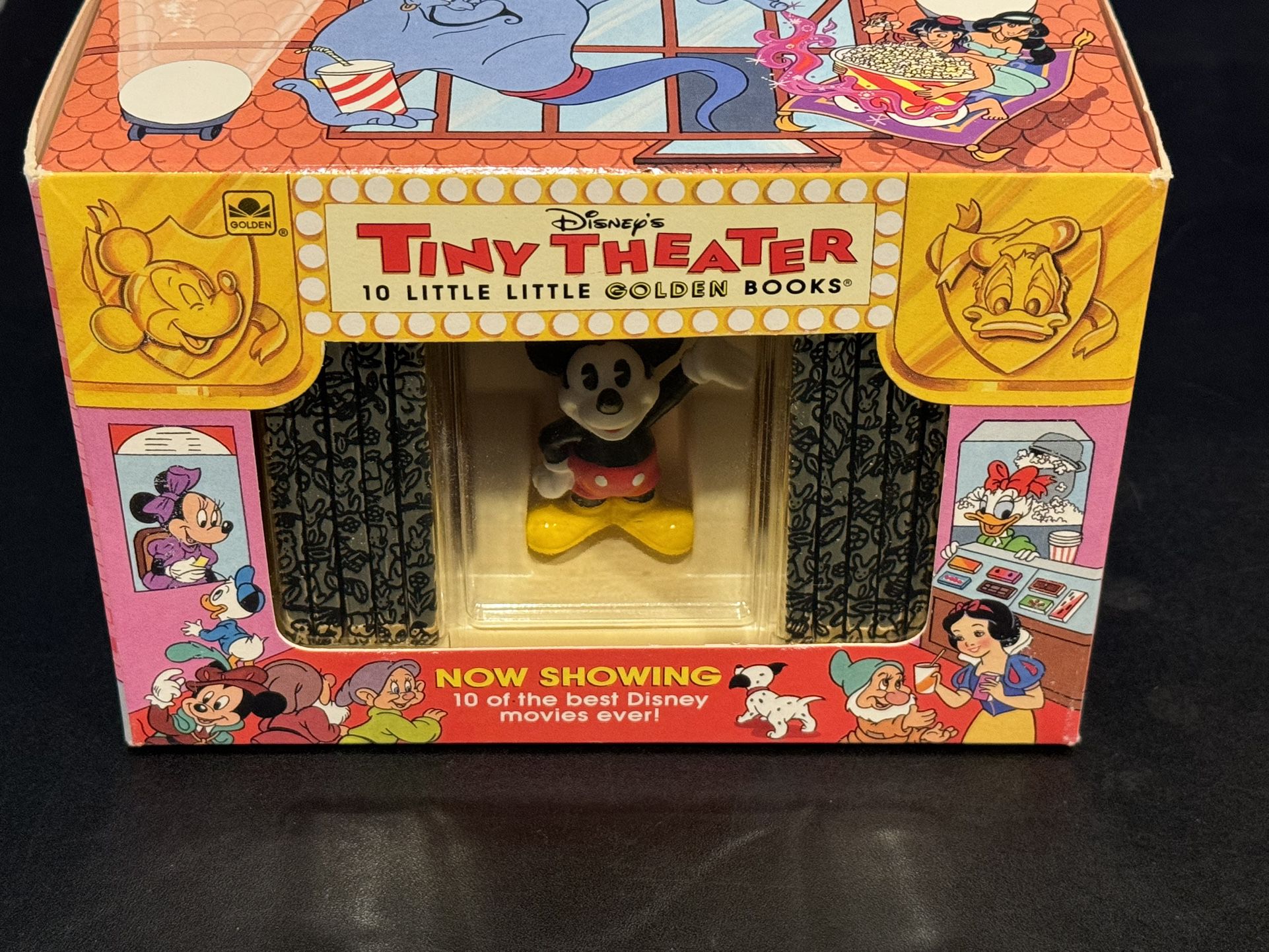 The product is a 1993 Disney's Tiny Theatre set that includes 10 Little Golden Books and a Mickey Mouse figure. The figure is part of the Mickey & Fri