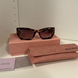 miumiu women’s Sunglasses MU 09WS
