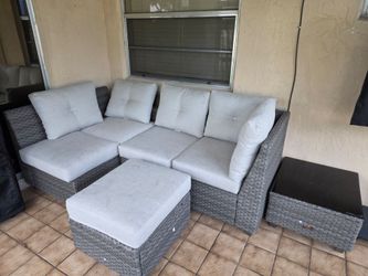 Outdoor patio furniture ( 2 sofas, ottoman  and a glass table)