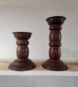Pair of traditional metal candlesticks with a dark brown, antiqued finish and a twisted design.