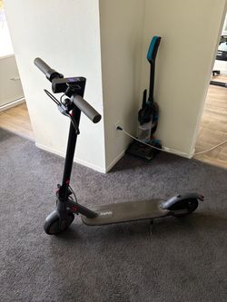 Joy his electric scooter