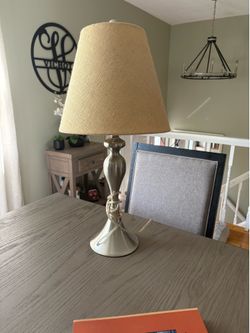 Pair of silver lamps with beige shades