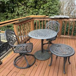 Wrought Iron Table And Rocking Swivel Chairs