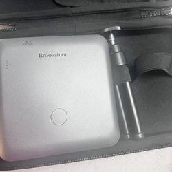 Brookstone Mini Projector And Speaker 