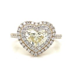 Designs 18K Double Halo Diamond Ring 💍❤️🤙🏾  18K yellow gold diamond ring. The center is set with a 1.23 carat heart shaped diamond, which has a cla