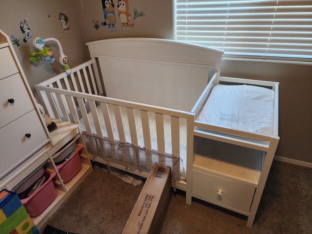White Baby Crib With Changing Table, Storage Shelf, Drawer and Mattress.