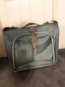 Garment/ luggage roller bag, has a bit of wear on outside front but nice and roomy for trips.
