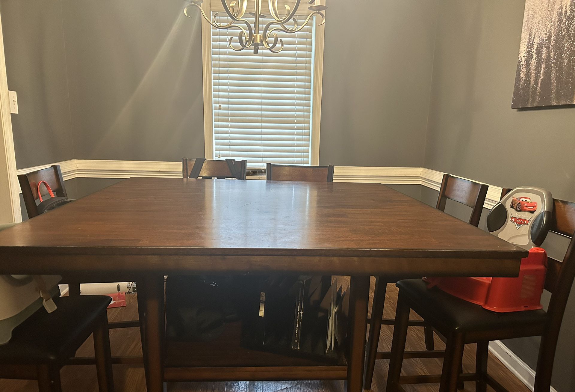 Brown Table With 8 Chairs And Storage Space Underneath