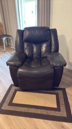 Manuel rocker recliner in great condition, no holes tears and minor wear