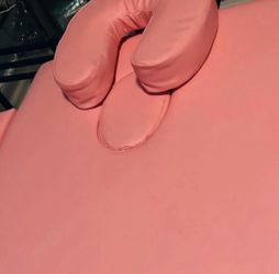 pink massage table with headrest