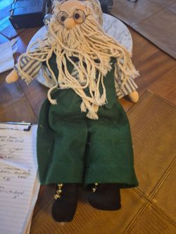 Vintage Saint Nicholas doll with green coat and mop like beard
