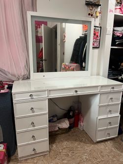 White elegant vanity with mirror light