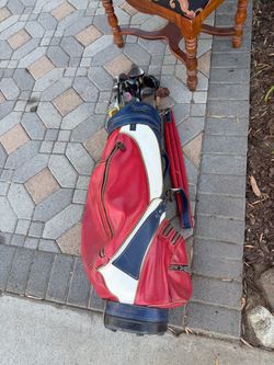Vintage golf bag with a bunch of golf clubs