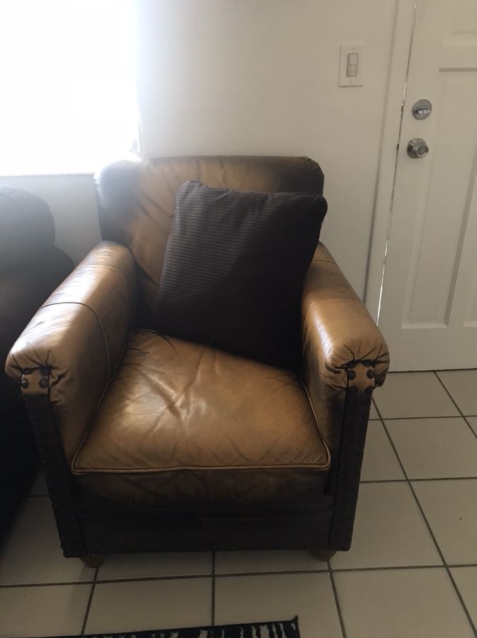 Brown chair with the ottoman