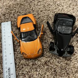 2 collectible cars ( black car’s glass is cracked )
