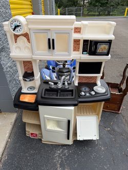 Step2 Great Gourmet Kitchen, an interactive plastic pretend-play kitchen set designed for toddlers.