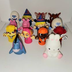 finger puppets from Rudolph the red nose reindeer, Peppa Pig, Paw Patrol, and eeyore 