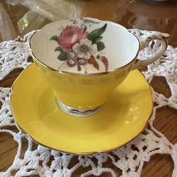 This Cup And Saucer Set Is A Beautiful Yellow With Multicolored Flowers With Gold Trim