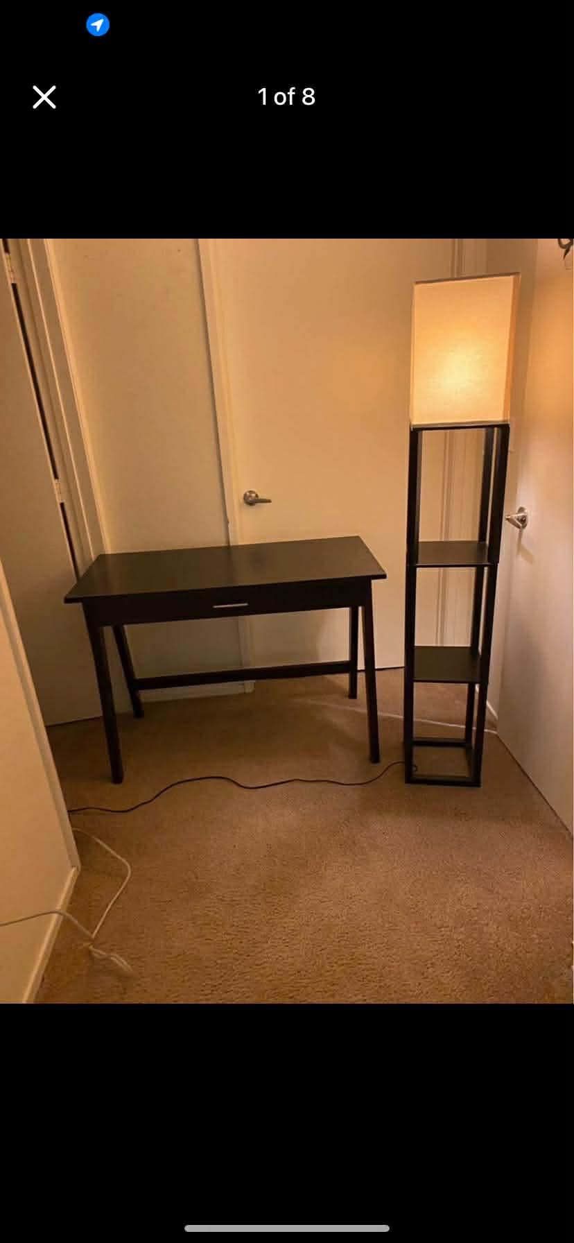 Black desk and a black lamp