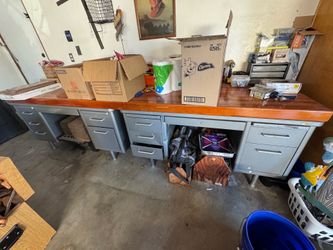 Work Bench including two metal desks and solid work top