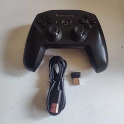 Steelseries Stratus Duo gaming controller with dongle.