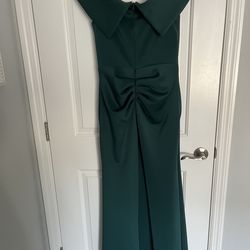 Dark green green gown with off the shoulder & ruched back