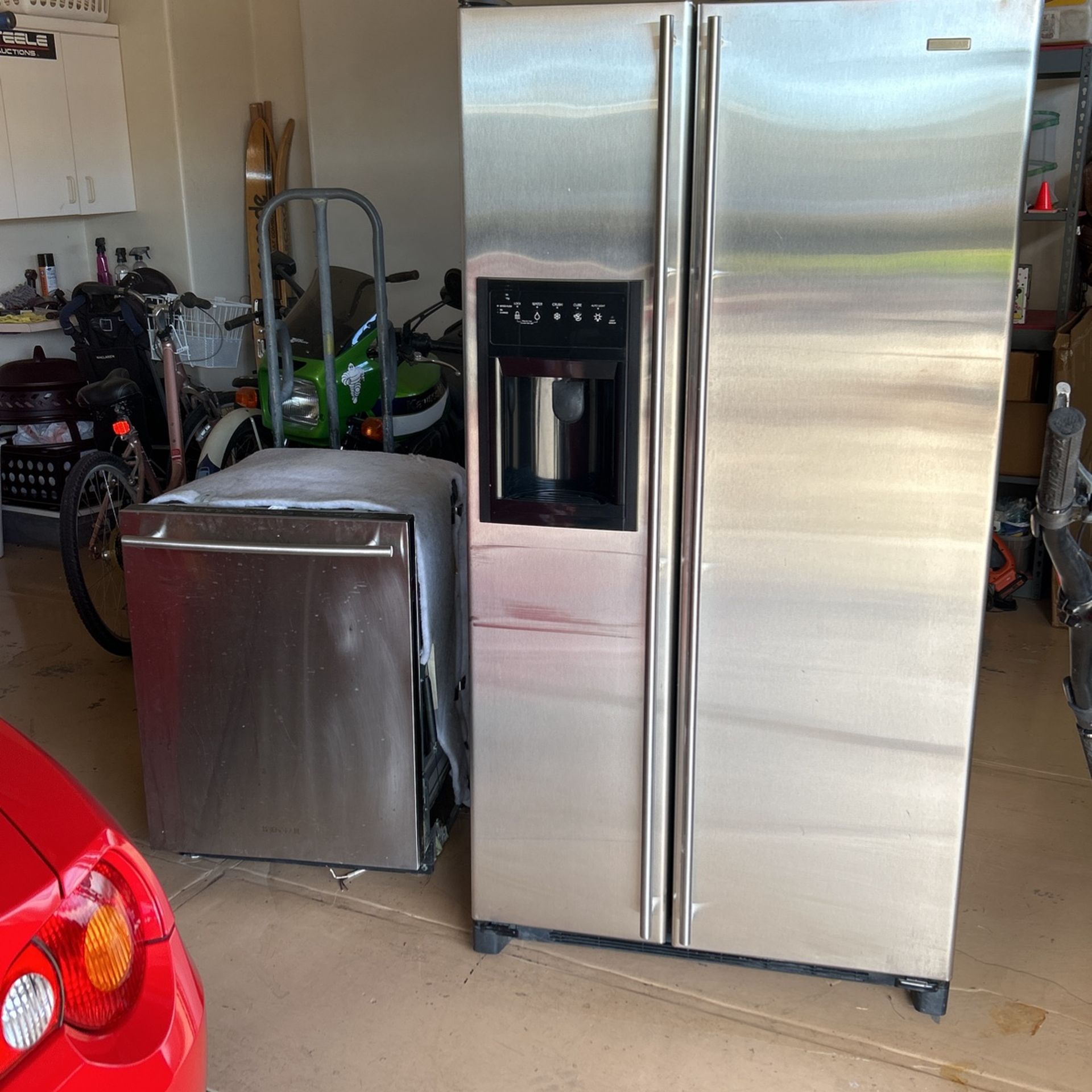 Matching Jenn-air stainless steel side-by-side refrigerator and dishwasher