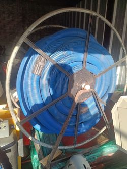 Carpet extraction hose reel