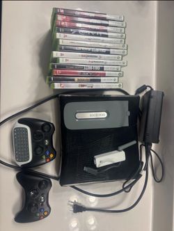XBox 360 with power cords, 2 controllers, 13 games