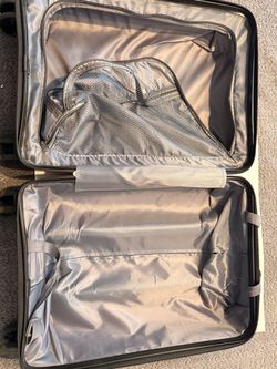 Pink rolling suitcase