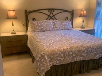 King bed frame, mattress, two nightstands and lamps