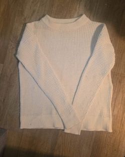 White knit sweater.