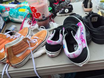 Girls, sneakers, three pairs, five dollars each. Size one the black pair of tie ups there girl. Size one