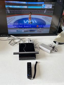 Nintendo Wii RVL-001 console system with controller and cords. No games.