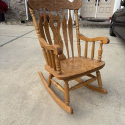 Vintage Solid Oak Rocking Chair. Etched wood design 