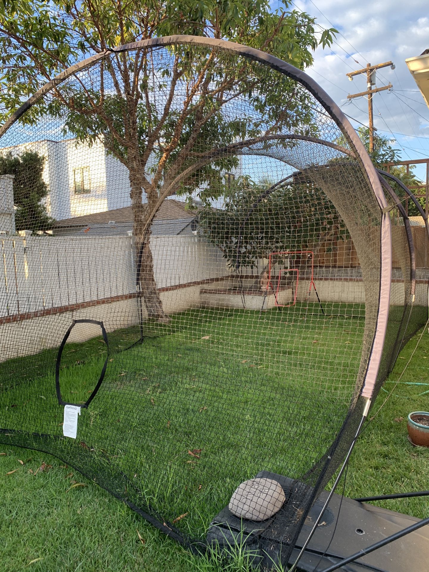 Batting cage, pitching machine, two adjustable bats. for Sale in San