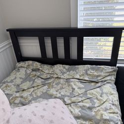 IKEA black twin bed with mattress