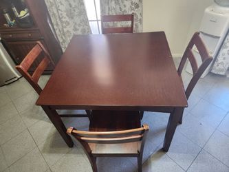 Solid wood dark cherry finish dining table and four chairs