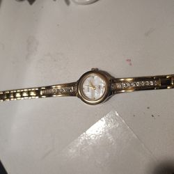 Armitron Now women’s gold‑tone watch (model 75/3899GP).