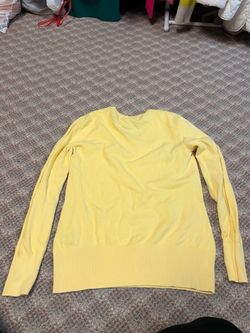 Knit Sweater features a lightweight fine-gauge knit, flattering V-neckline