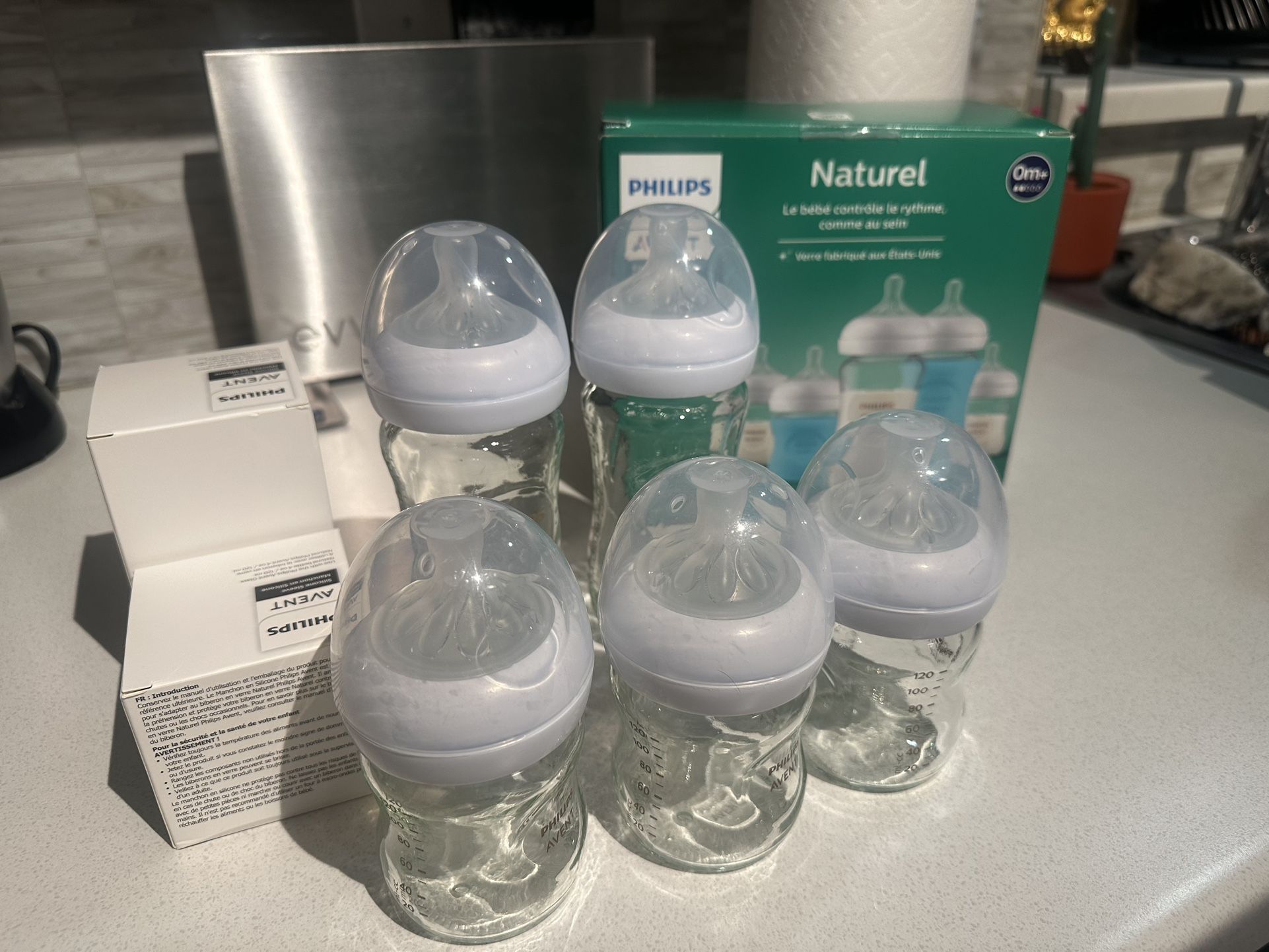 Baby Bottles 0m-1m+, size 1 diapers, assorted pacifiers, baby wipes warmer